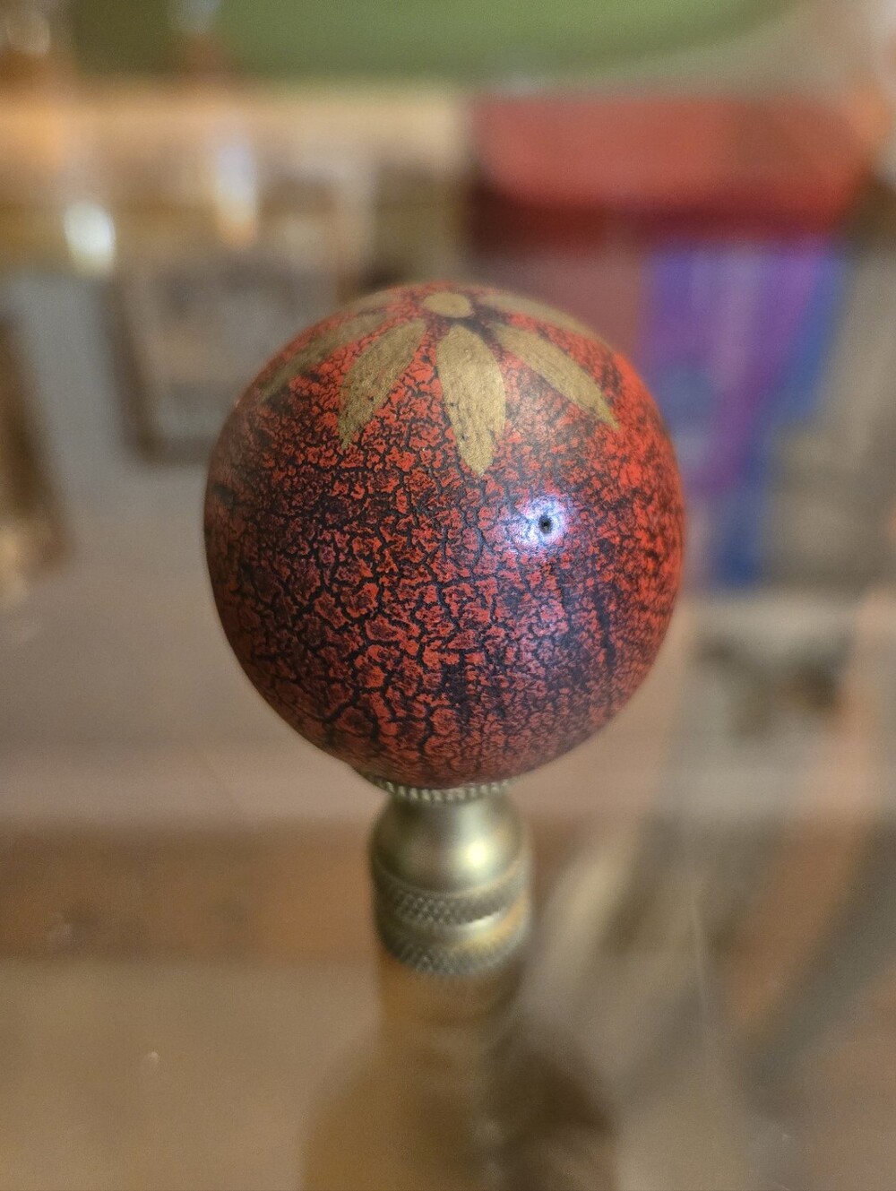 Hand-Painted Red Crackle Ball Finial with Gold Flower Accent